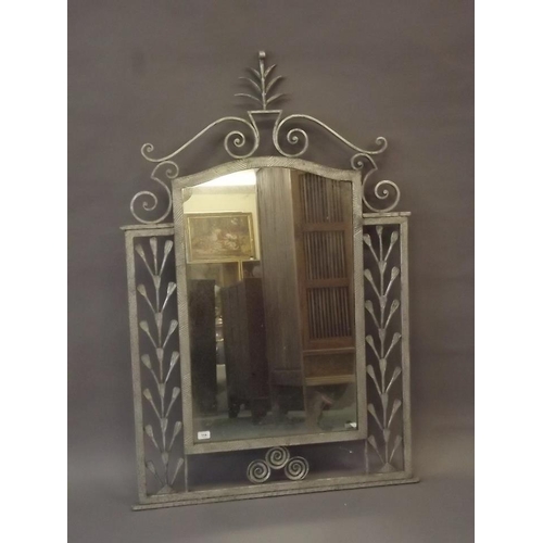 842 - A silvered wrought iron pier glass, 56