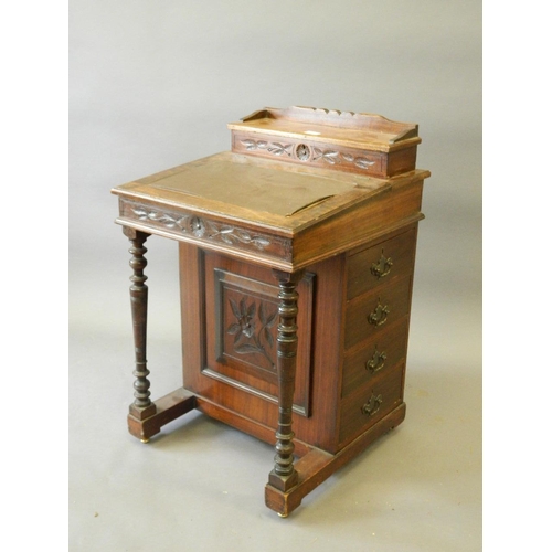 847 - An Edwardian walnut and mahogany davenport, 21