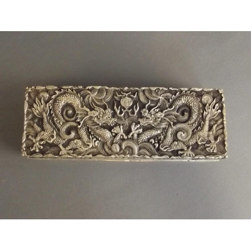 10 - A Chinese white metal scribe's box with incised twin dragon and flaming pearl decoration, 6 characte... 