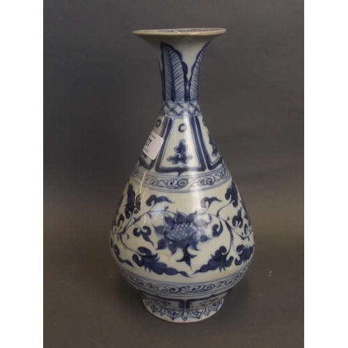 27 - A Chinese Yuan style blue and white porcelain pear shaped vase with lotus flower decoration, 10½