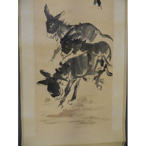 42 - A Chinese monotone watercolour scroll depicting donkeys grazing, 18