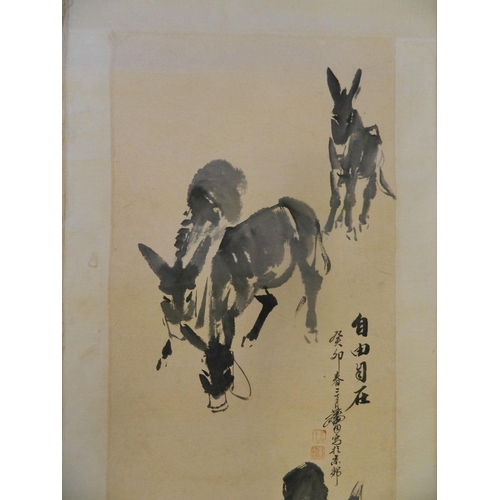 42 - A Chinese monotone watercolour scroll depicting donkeys grazing, 18