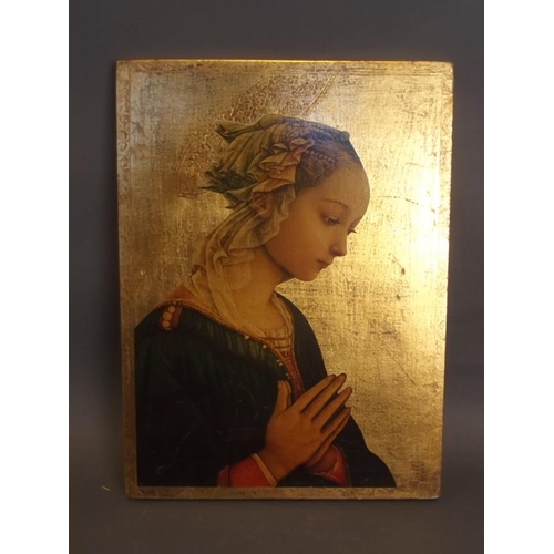 50M - A gilt icon with printed decoration of a young woman at prayer, 11