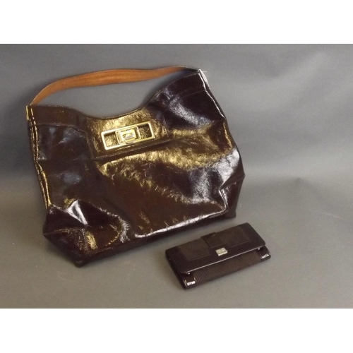 50T - A brown leather designer handbag by Anya Hindmarch, together with a matching purse, 17