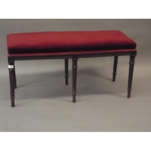 839 - A C19th mahogany window seat with lamb's tongue decorated frieze, raised on six fluted supports, 38