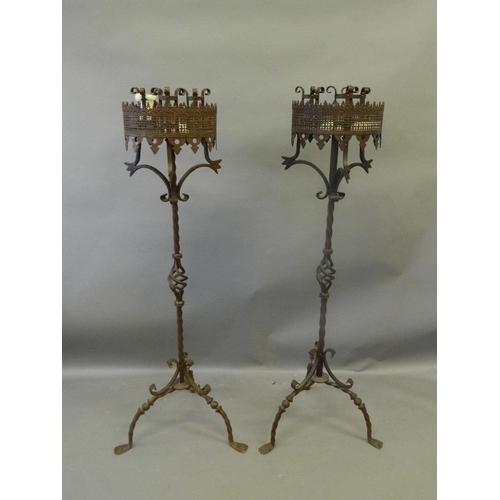 840 - A pair of large late C19th/early C20th wrought iron torchères with pierced gallery, on twist stems a... 