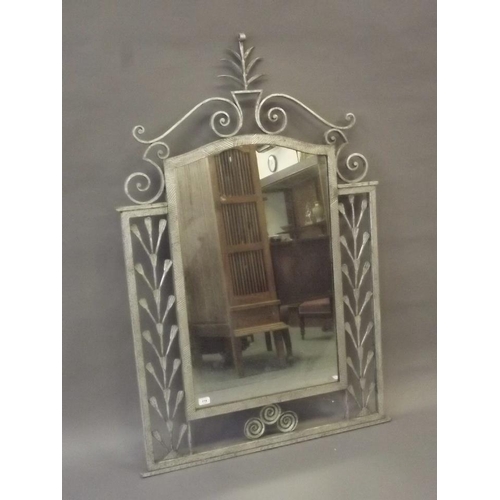 842 - A silvered wrought iron pier glass, 56