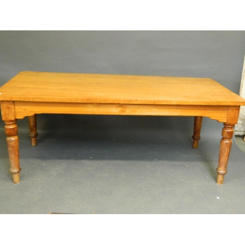 844 - A satinwood dining table raised on turned supports, 72