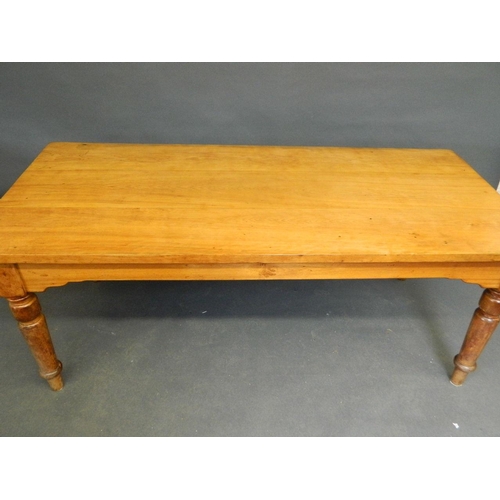 844 - A satinwood dining table raised on turned supports, 72