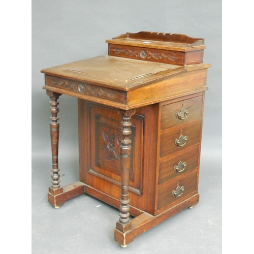 847 - An Edwardian walnut and mahogany davenport, 21