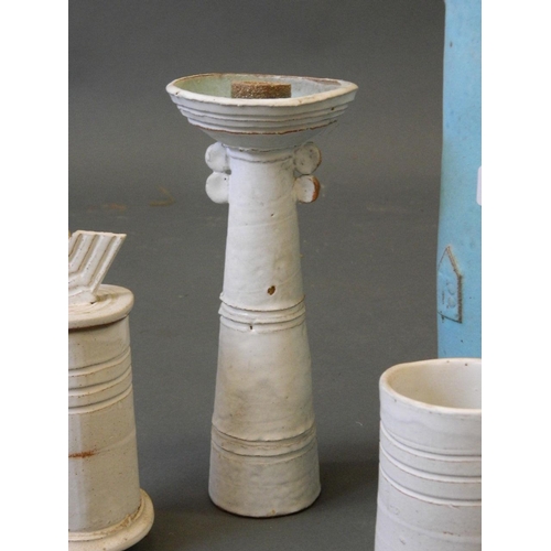 18 - A collection of studio pottery by Terry Burton, including a vase, candlestick and jars, largest 9½