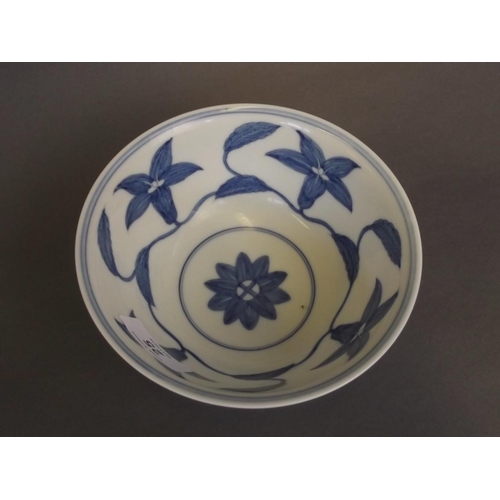 25 - A Chinese blue and white porcelain rice bowl with foliate decoration, 6 character mark to base, 6