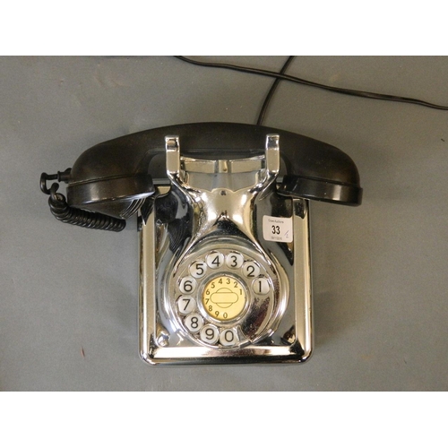 33 - A vintage chrome plated wall mounted telephone with Bakelite handle, and a later ivory coloured tele... 