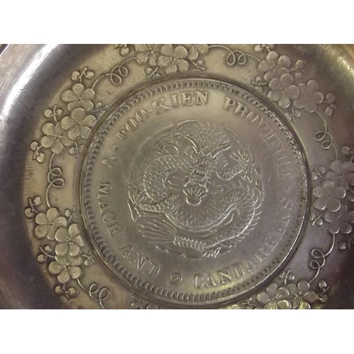 34 - A Chinese white metal coin dish, 3