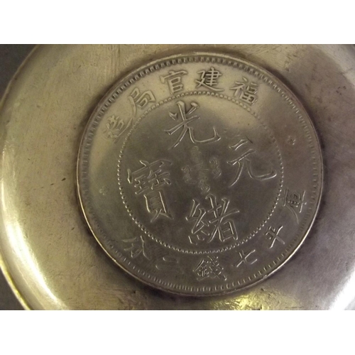 34 - A Chinese white metal coin dish, 3