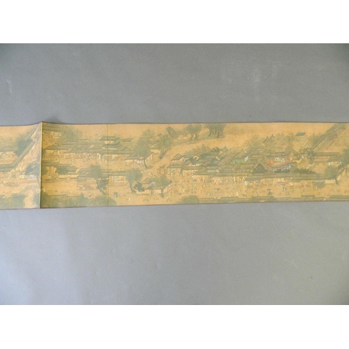 38 - A Chinese printed scroll depicting an extensive landscape with temple complexes, palaces, villages a... 