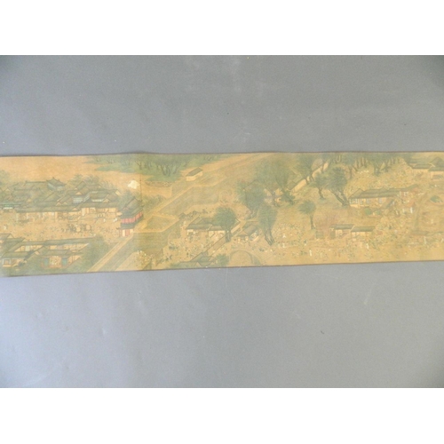 38 - A Chinese printed scroll depicting an extensive landscape with temple complexes, palaces, villages a... 