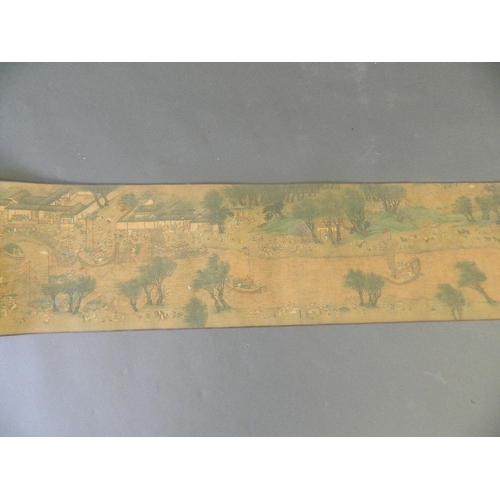 38 - A Chinese printed scroll depicting an extensive landscape with temple complexes, palaces, villages a... 