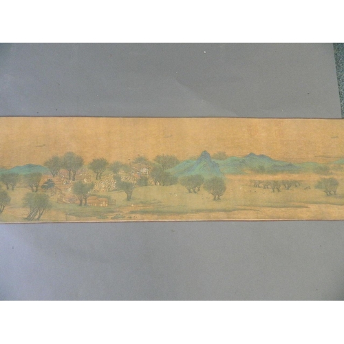 38 - A Chinese printed scroll depicting an extensive landscape with temple complexes, palaces, villages a... 