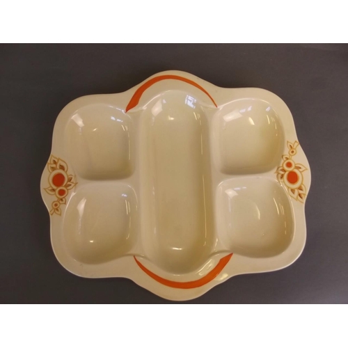 4 - A five section pottery serving dish with cream ground and red floral decoration, after Clarice Cliff... 