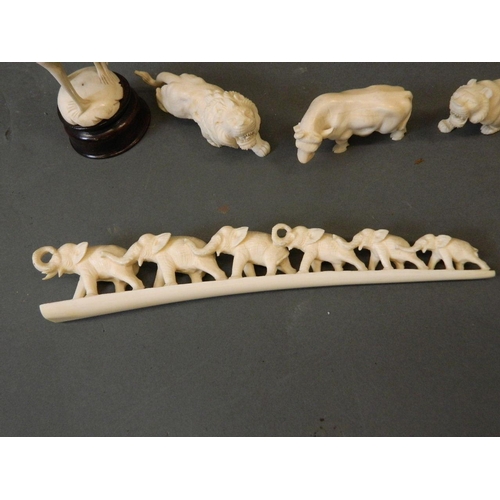 50A - A collection of late C19th/early C20th Cantonese ivory figures carved in the form of a tiger, lion, ... 