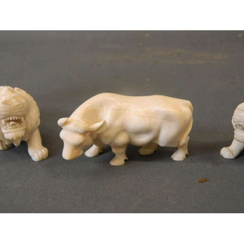 50A - A collection of late C19th/early C20th Cantonese ivory figures carved in the form of a tiger, lion, ... 