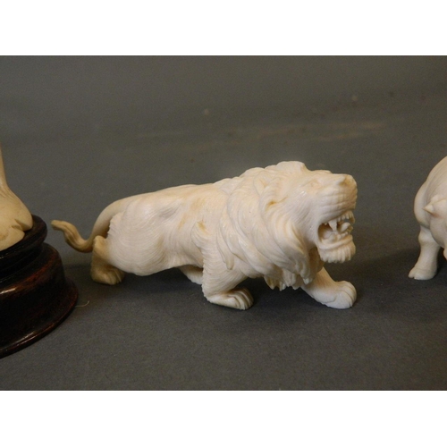 50A - A collection of late C19th/early C20th Cantonese ivory figures carved in the form of a tiger, lion, ... 