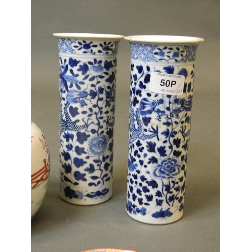 50P - A pair of late C19th/early C20th Chinese porcelain cylinder vases with blue and white dragon decorat... 