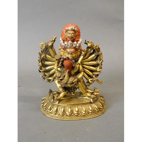 50W - An antique Sino-Tibetan gilt and painted bronze figure of Yamantaka, titular Mahayana deity embracin... 