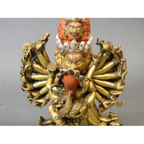 50W - An antique Sino-Tibetan gilt and painted bronze figure of Yamantaka, titular Mahayana deity embracin... 