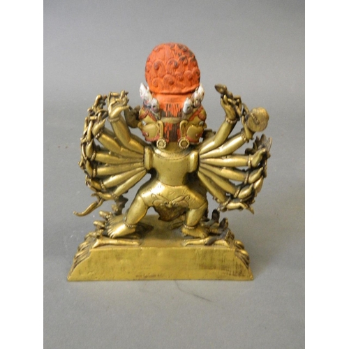 50W - An antique Sino-Tibetan gilt and painted bronze figure of Yamantaka, titular Mahayana deity embracin... 