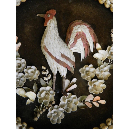 26 - A basket work and shell plaque depicting a cockerel amongst flowers, 14