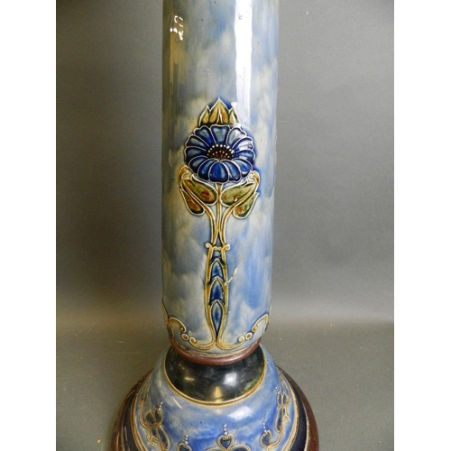 38 - A Doulton pottery jardinière stand with raised enamel floral decoration, 27½