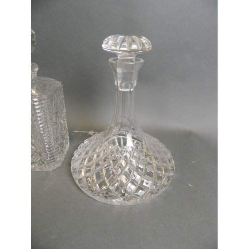 46 - A matched pair of cut glass decanters, together with a cut glass ship's decanter, and another, large... 