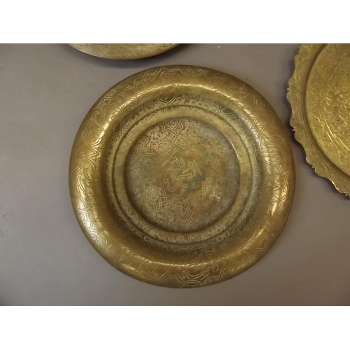 50M - Two Middle Eastern brass wall plaques with Islamic calligraphy and designs, a shaped dish with Tree ... 