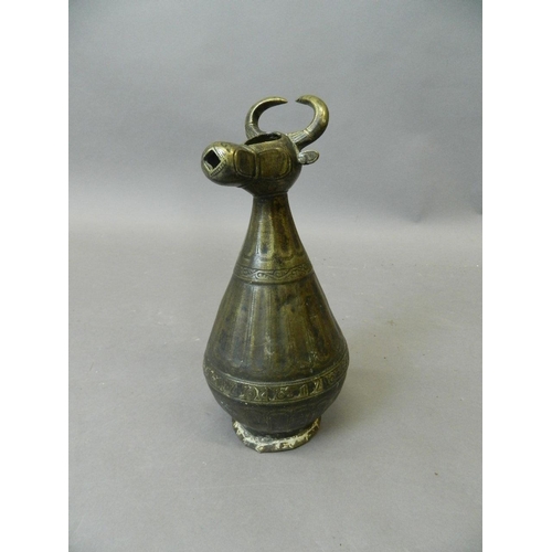 50Q - An antique Middle Eastern bronze pourer in the form of a bull, 10