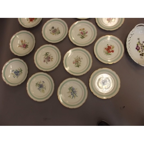 50X - A C19th porcelain dessert service comprising three pedestal tazzas and eleven plates decorated with ... 