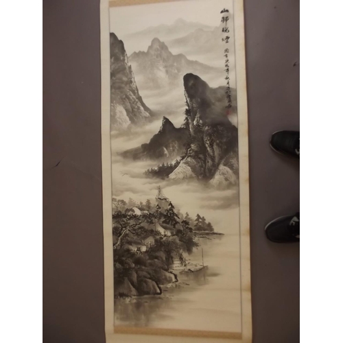 50Z - A Chinese black and white scroll depicting a mountain river landscape, signed in calligraphy with re... 