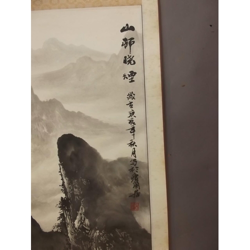 50Z - A Chinese black and white scroll depicting a mountain river landscape, signed in calligraphy with re... 