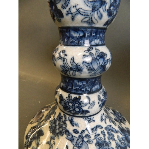 7 - A pair of Oriental crackle glazed porcelain candlesticks with blue and white decoration of birds, fr... 