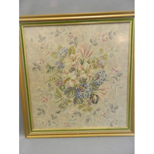 8 - A framed wool work of a floral bouquet, 23