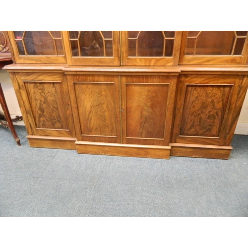 872 - A C19th figured mahogany breakfront four door bookcase, in two sections, with astragal glazed upper ... 