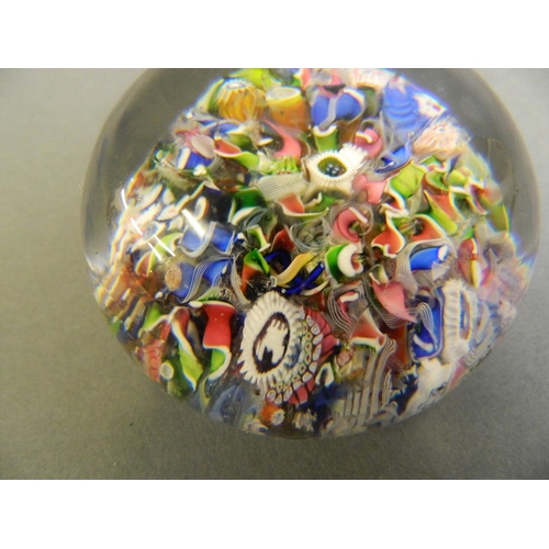 100 - A fine Millefiori glass paperweight with multiple rods and leaves, possibly Baccarat, 2½