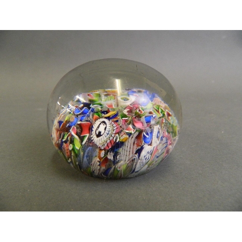 100 - A fine Millefiori glass paperweight with multiple rods and leaves, possibly Baccarat, 2½