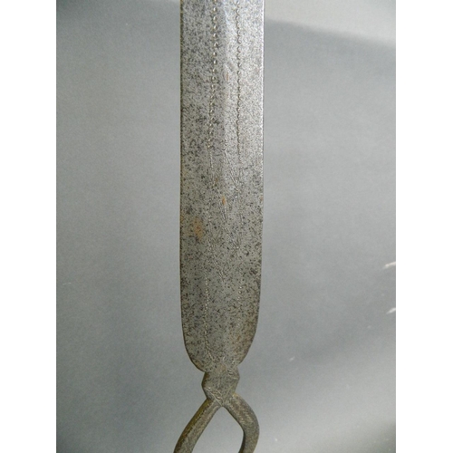 108 - An African Zulu spear head with engraved and punched decoration, mounted on a later base, 23