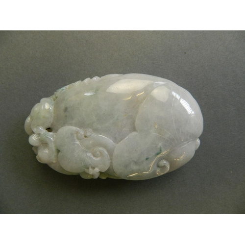 110 - A Chinese mottled tri-colour jade pendant/scroll weight with carved twin kylin decoration, 3½