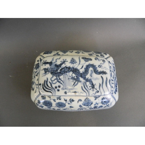 111 - A Chinese blue and white porcelain scribe's box decorated with a dragon amongst water lilies, 6 char... 