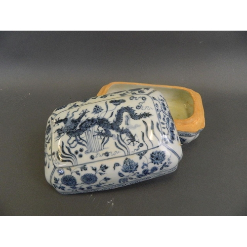 111 - A Chinese blue and white porcelain scribe's box decorated with a dragon amongst water lilies, 6 char... 