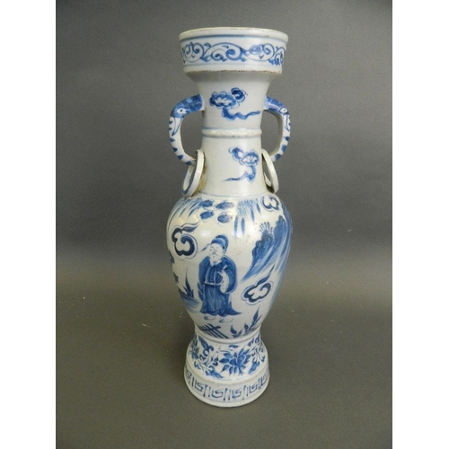 126 - A Chinese Ming style blue and white twin handled vase with painted decoration of a sage in a landsca... 