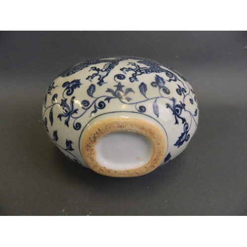 127 - A Chinese blue and white porcelain moon flask decorated with a dragon chasing the flaming pearl, 6 c... 